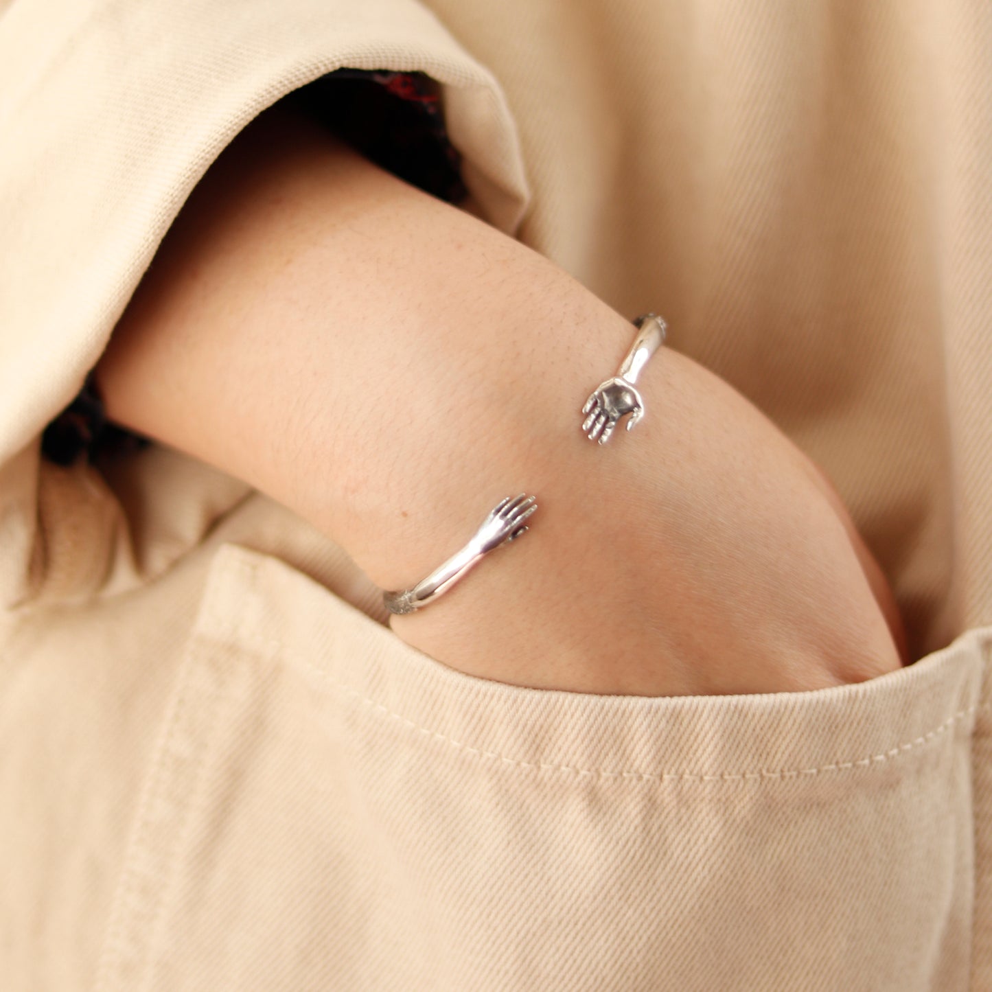 Reaching Hands Bracelet