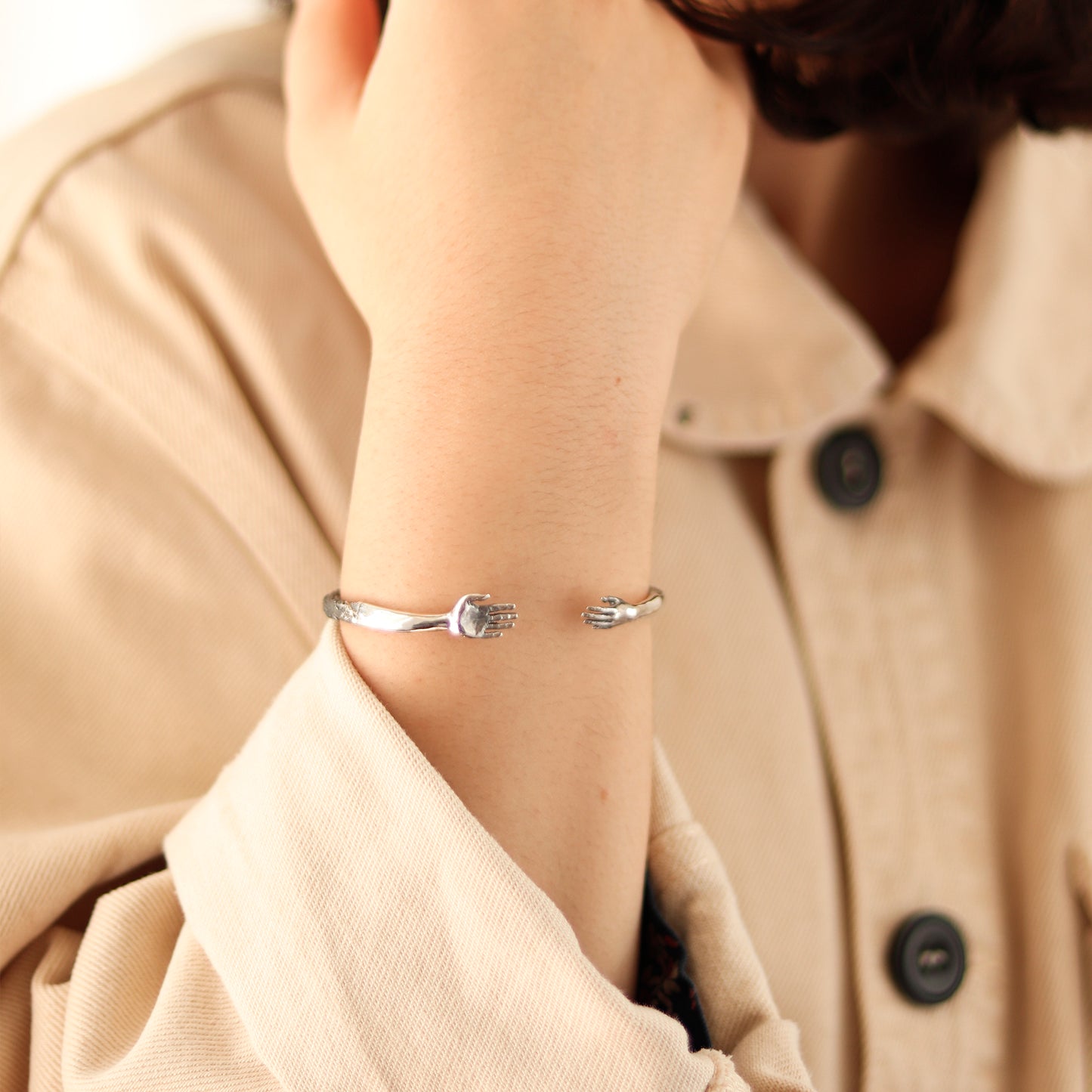 Reaching Hands Bracelet